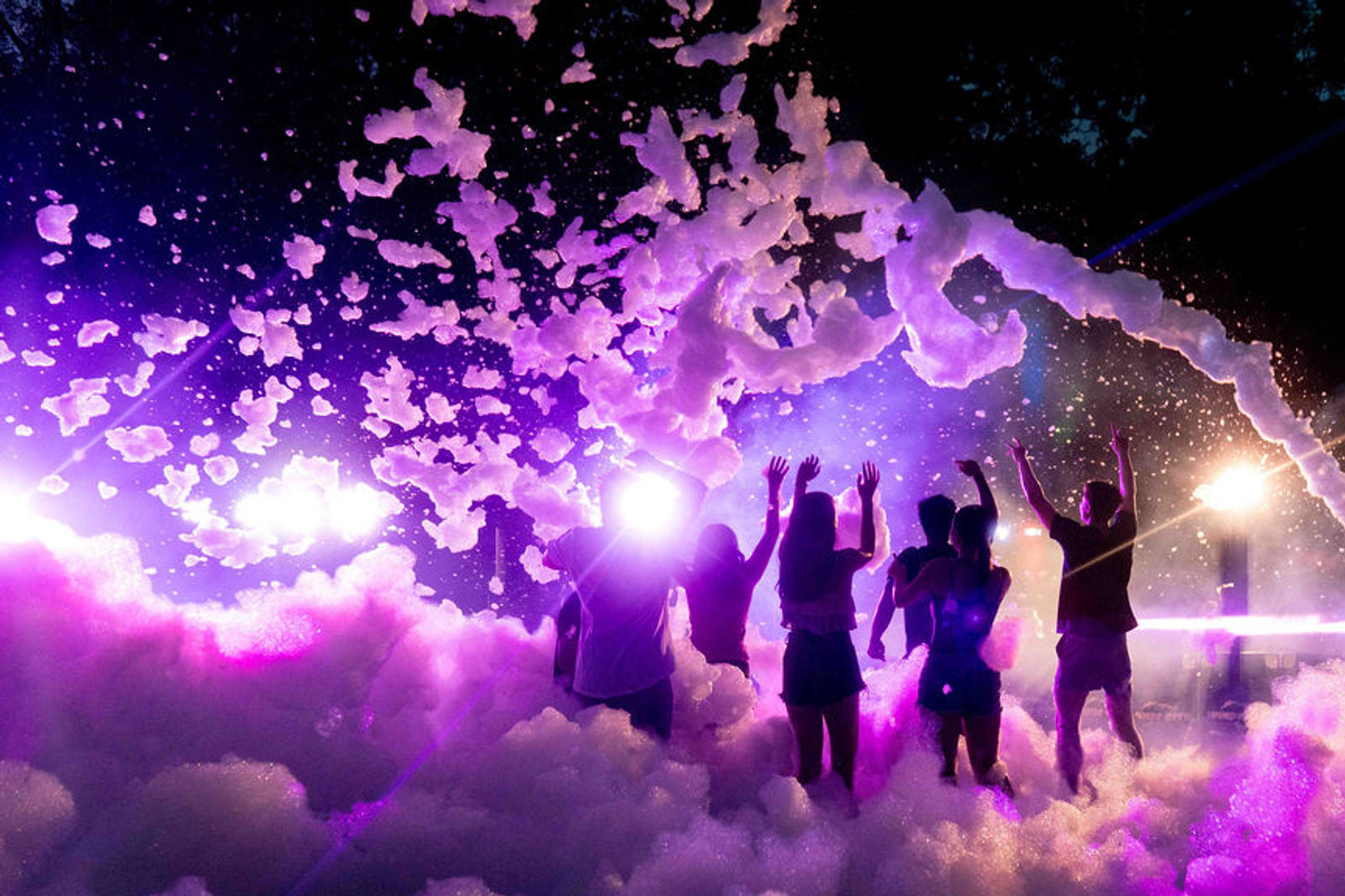 A nighttime foam event under production lighting
